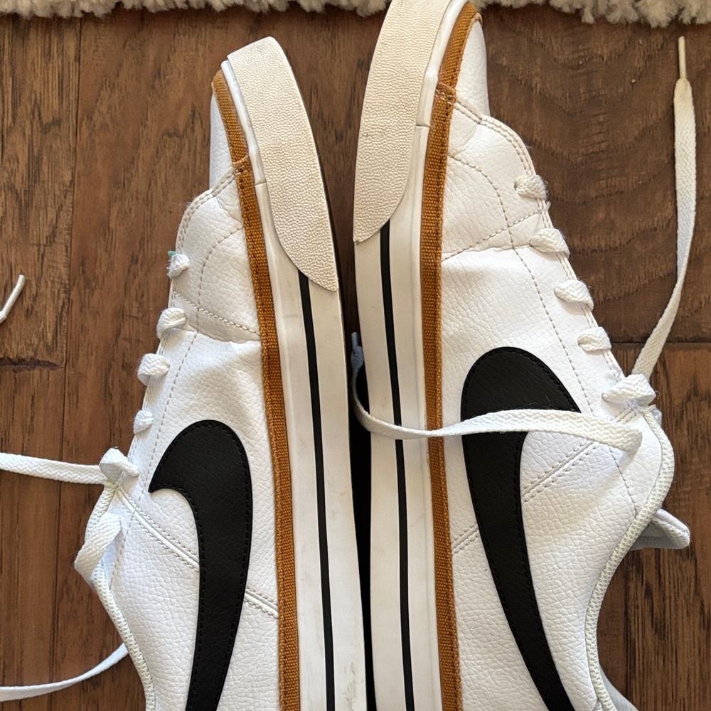 Nike White and Black Sneakers with Gold Accents